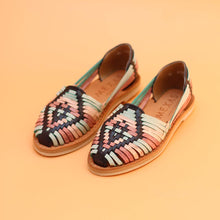 Load image into Gallery viewer, Pair of woven sandals with a geometric pattern on an orange background