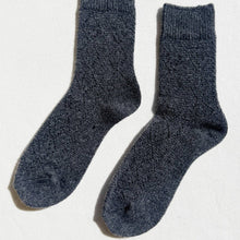 Load image into Gallery viewer, Pair of dark blue socks on a light gray background
